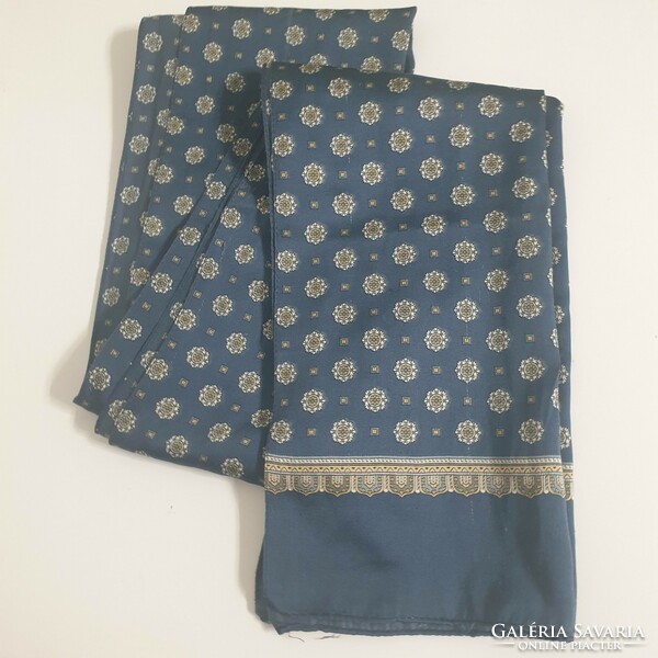 Patterned suit scarf and neck scarf on a blue background