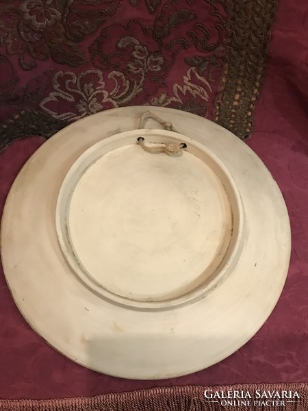 Antique majolica bowl with a plastic figural scene: the dance of Salome