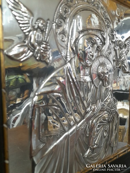 Old silver embossed religious icon image.