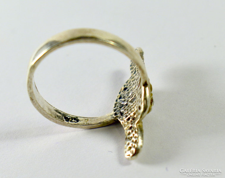 Wide non-figurative silver ring with tiny stones