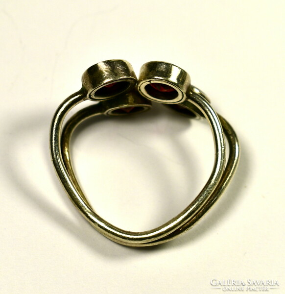 Large silver ring with 4 larger round polished garnet gemstones