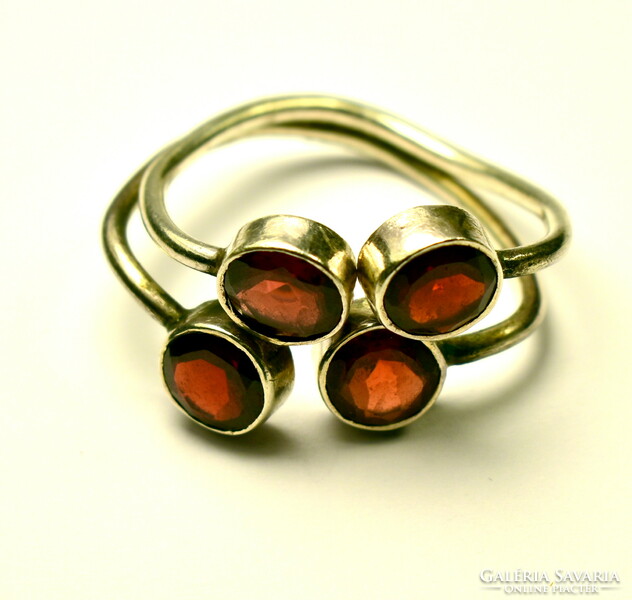 Large silver ring with 4 larger round polished garnet gemstones