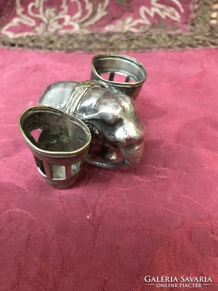 A silver-plated elephant figurine with a tabletop tooth pick or meat skewer or glass storage!