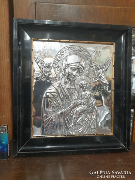 Old silver embossed religious icon image.