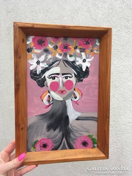 Portrait painting in a striking wooden frame