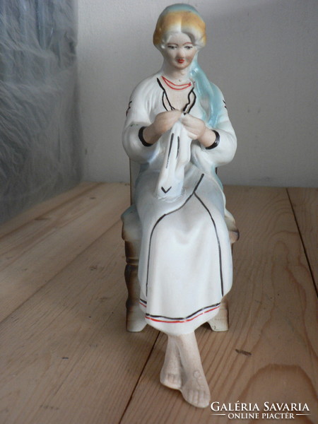 Sewing lady, porcelain statue