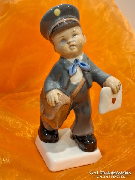 Granite ceramic figure with postman's love letter.