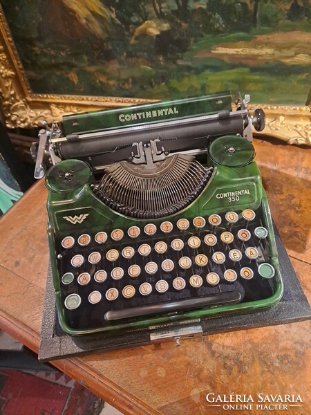Continental 350 typewriter in green dress around 1930