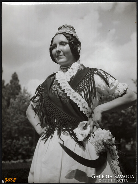 Larger size, photo art work by István Szendrő. A girl in folk costume, mite, fierce