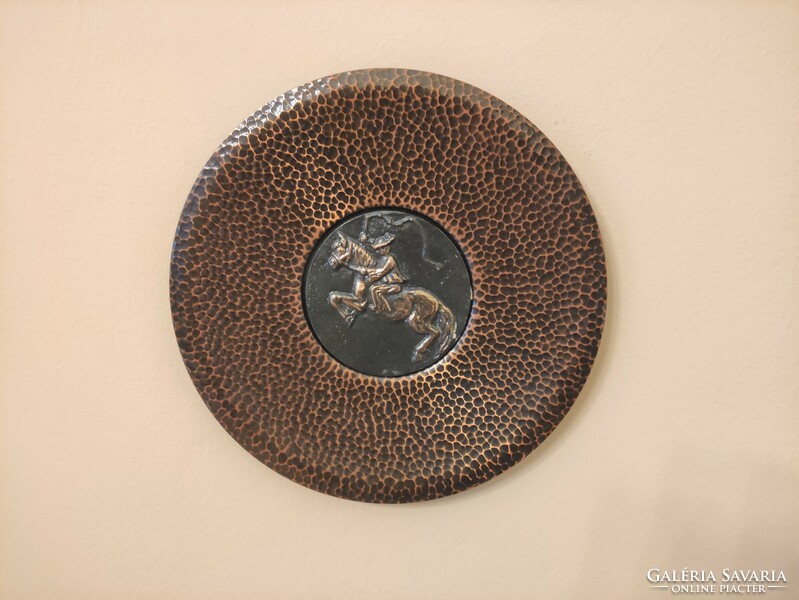 Industrial punched embossed red copper wall bowl with a teasing horse outlaw theme in the middle