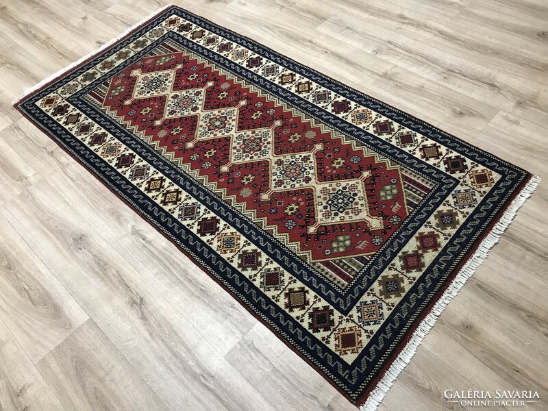 Old hand-knotted wool Persian rug from Békésszentandra, 102 x 205 cm