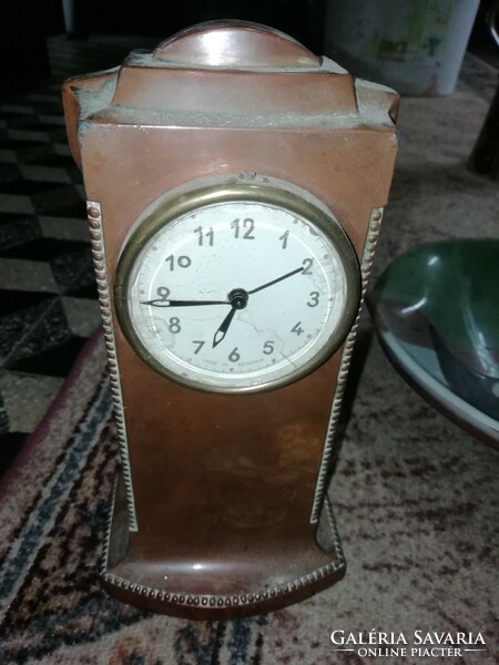 Antique table clock is in the condition shown in the pictures