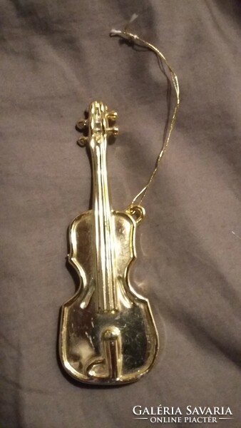 Old, gold-colored violin Christmas tree decoration