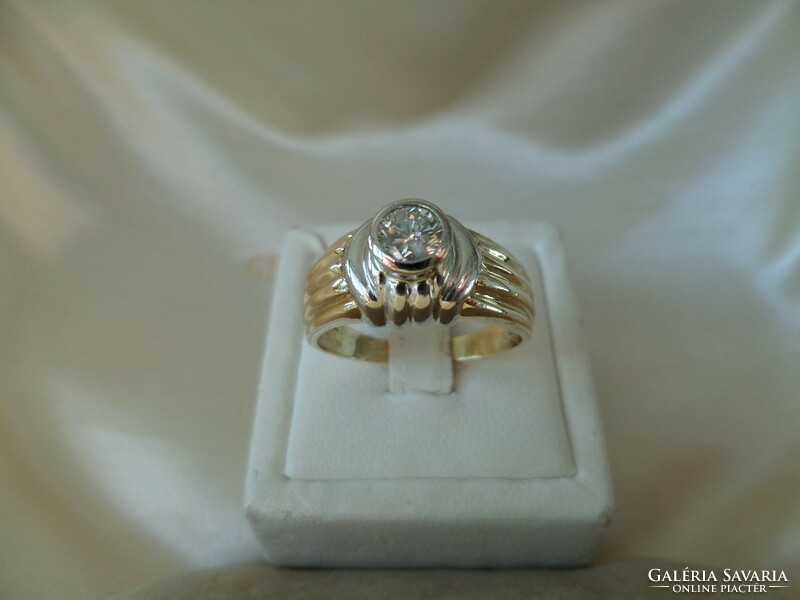 Yellow - white gold ring with 0.35 Ct brill