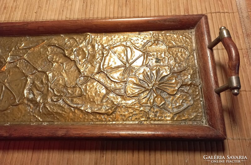A small wooden tray with an inlaid copper plate.