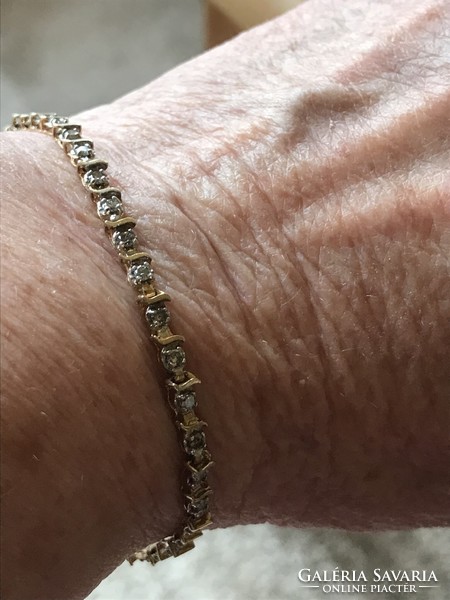 Yellow gold tennis bracelet with diamonds