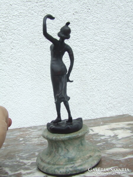 Dancing woman iron statue