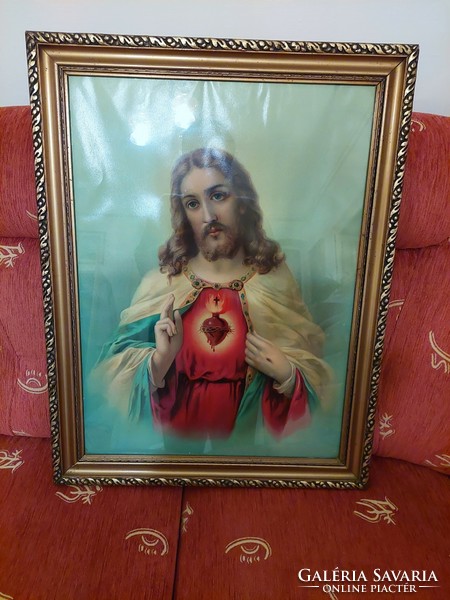 The heart of Jesus in a large, gilded frame