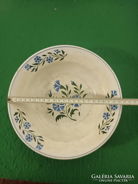 A decorative plate of folk character.