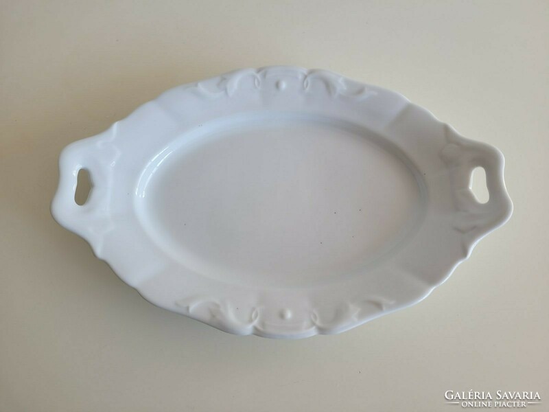 Old white porcelain serving oval bowl with a handle