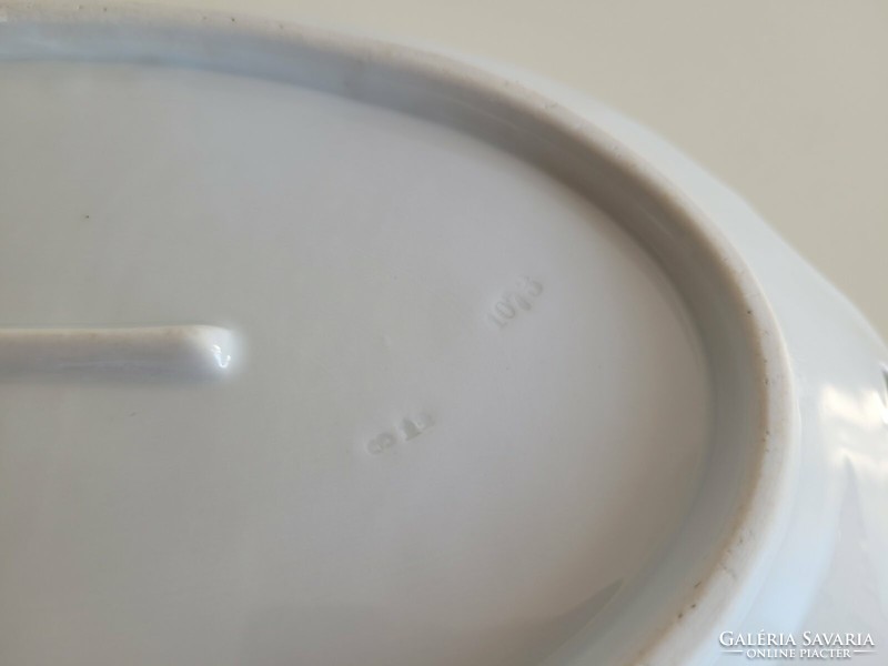 Old white porcelain serving oval bowl with a handle