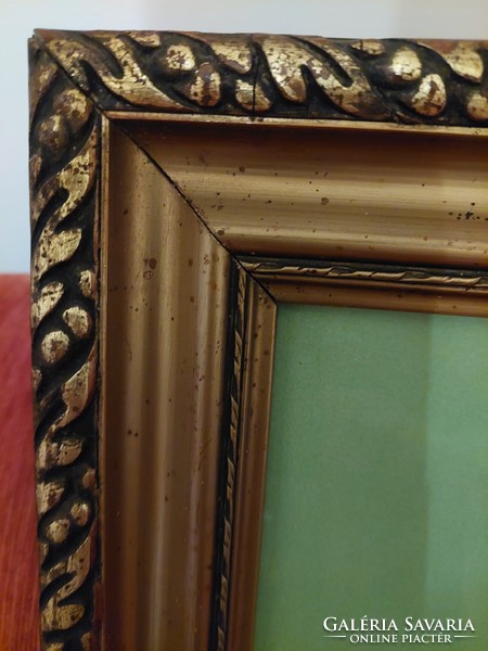 The heart of Jesus in a large, gilded frame