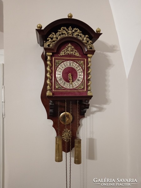 A rare, beautiful, half-baked pendulum Dutch wall clock. With copper columns, ornaments, Roman dial.