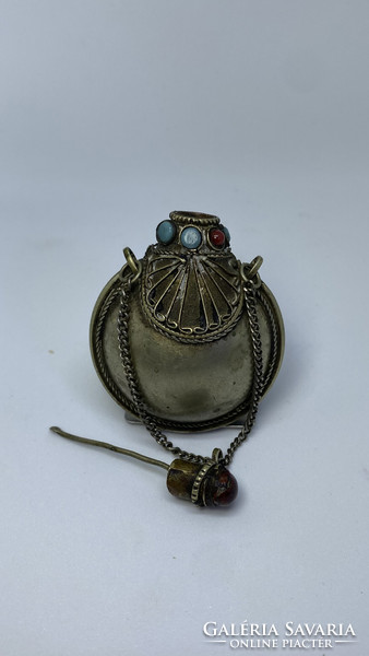A small, antique snuff holder of Tibetan origin