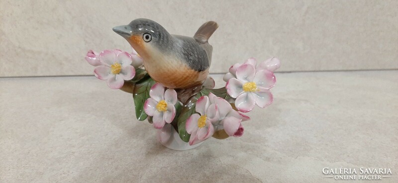 Herend porcelain bird on a blossoming cherry tree branch