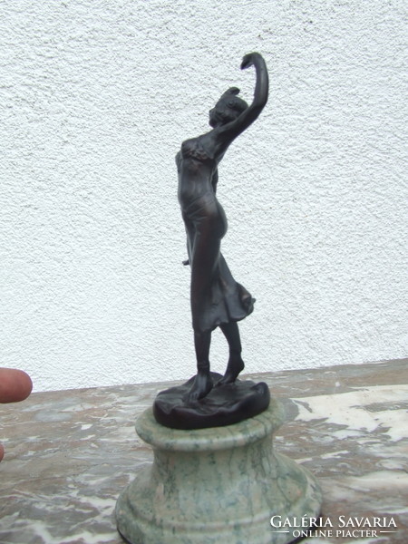 Dancing woman iron statue