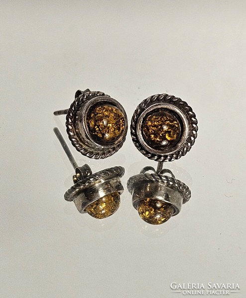 Silver earrings decorated with amber