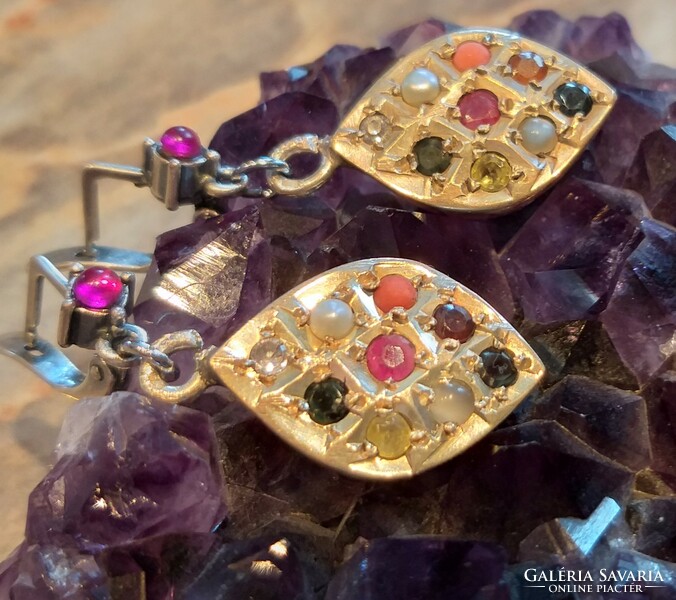 Silver earrings marked with 10 gemstone navaratna chakra