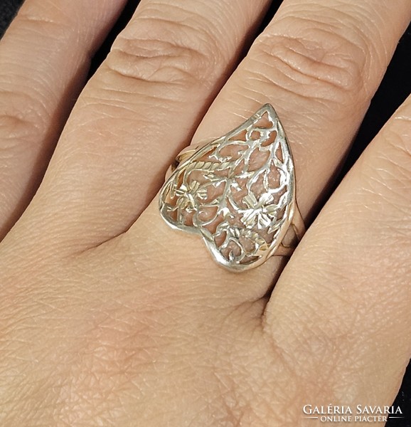 Heart-shaped silver ring with an openwork flower pattern