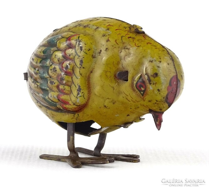 1P771 Old German sheet metal watchmaker's wind-up peeping chick with key