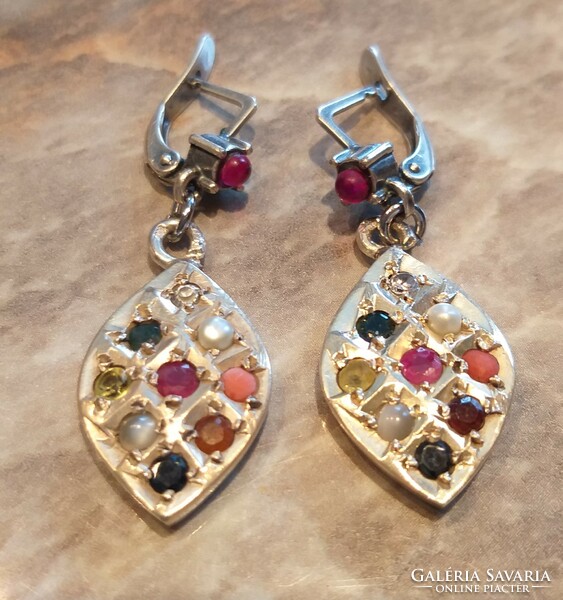 Silver earrings marked with 10 gemstone navaratna chakra