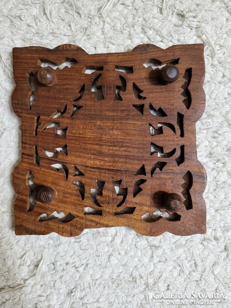 Carved wooden table decoration depicting a menorah, placemat