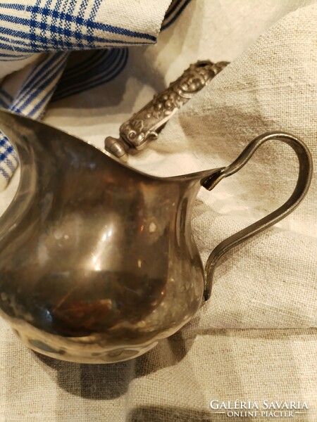 Silver-plated jug, spout - in an antique atmosphere