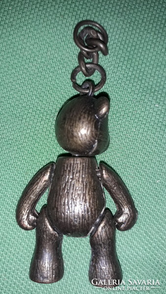Old copper moving teddy bear keychain figure according to the pictures