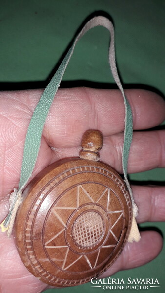 An old small travel souvenir, a small hand-carved wood souvenir, as shown in the pictures