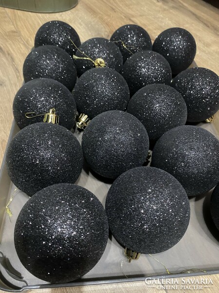 Light, showy, shiny and flashing black plastic spheres