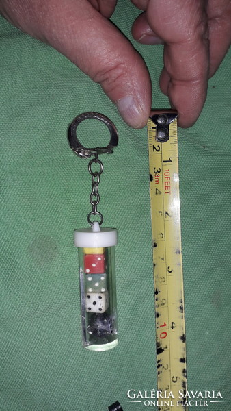 Retro traffic plastic cylinder with small plastic colored dice inside, key holder according to the pictures 2.