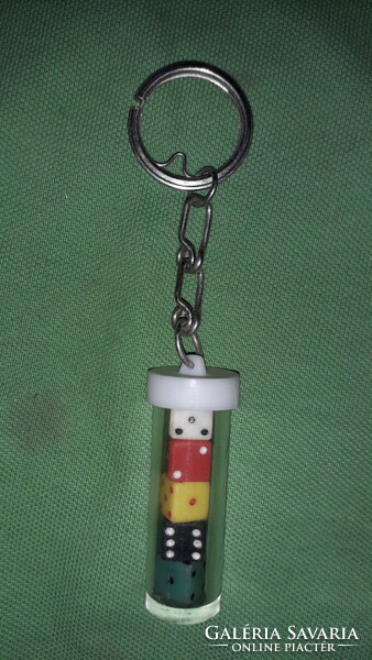 Retro traffic plastic cylinder with small plastic colored dice inside, key holder according to the pictures 1.