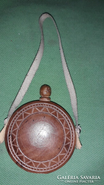 An old small travel souvenir, a small hand-carved wood souvenir, as shown in the pictures