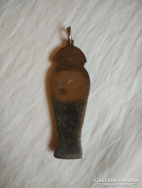 Enameled metal pendant depicting an Egyptian figure