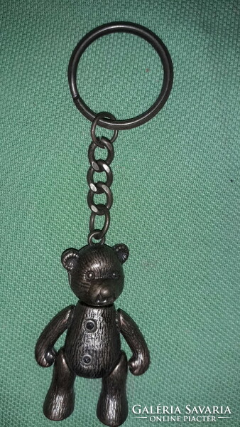 A moving teddy bear figurine key ring in all flavors of old copper, as shown in the pictures