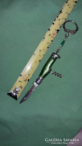 Retro tobacconist multi-functional mini knife keychain with green vinyl handle as shown in the pictures