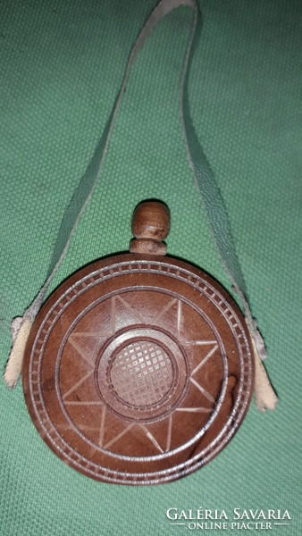 An old small travel souvenir, a small hand-carved wood souvenir, as shown in the pictures