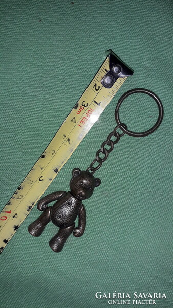 A moving teddy bear figurine key ring in all flavors of old copper, as shown in the pictures