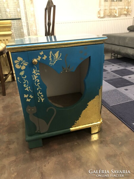 Antique bedside table, converted into a cat house.