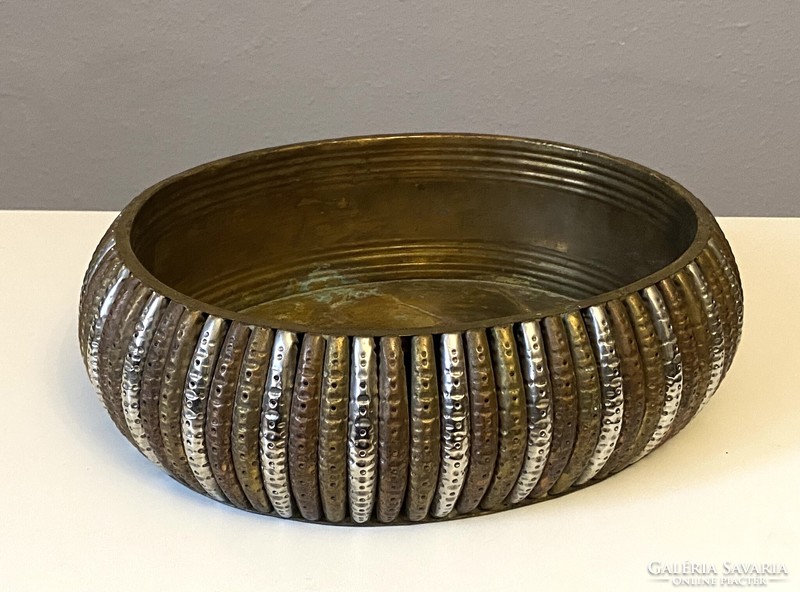 Made of copper, decorated with silver-colored metal, with ribbed edges, an oval table-top metal serving bowl, a flower pot